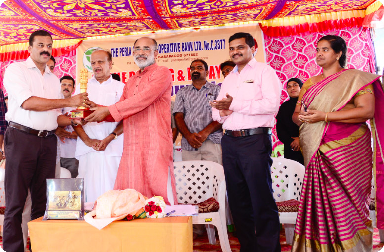C.P Manoj, Managing Director of Silicon IT Solutions receiving award from Sri. Alphons Kannanthanam (Hon Union minister of state electronics and information technology, Govt of India) in presence of P. Karunakaran (Member of Parliament).