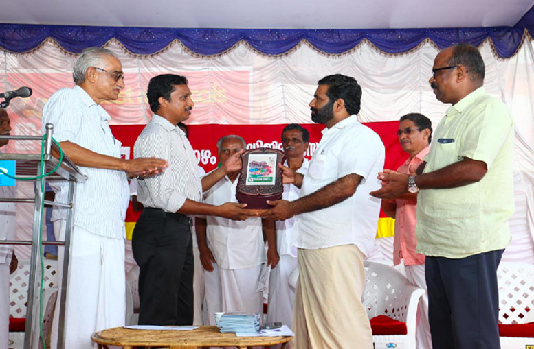 Sudheesh K V, Project Manager of Silicon IT Solutions receiving award from T.V. Rajesh (Member of Legislative Assembly Kerala) - for complete digitalization of Cheruthazham Service Co-Op Bank Ltd.